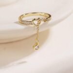 Creative Hollow Heart Shaped Tasseled Gold-Plated Cubic Zirconia Adjustable Open Ring, Jewelry Gift With Box For Daily Wear, Party. Style: Elegant Occasion: Daily Element: Heart Gender: Women Material: Copper