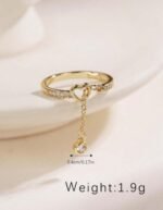 Creative Hollow Heart Shaped Tasseled Gold-Plated Cubic Zirconia Adjustable Open Ring, Jewelry Gift With Box For Daily Wear, Party. Style: Elegant Occasion: Daily Element: Heart Gender: Women Material: Copper - Image 4